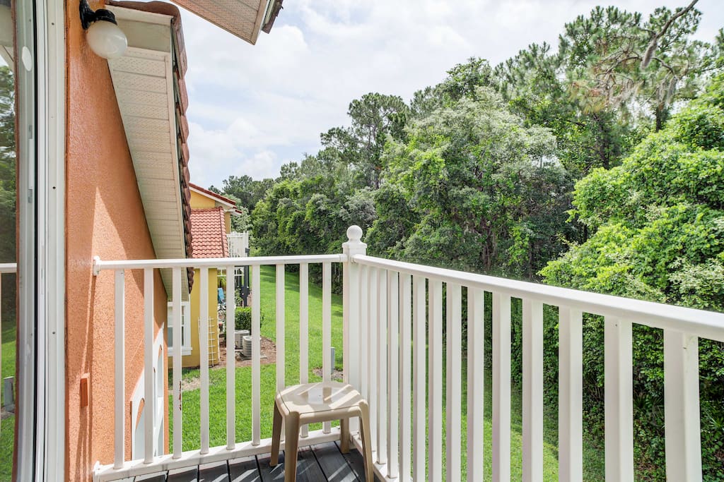 Surrounded by a conservation area, you'll enjoy verdant foliage and serene views from the top balcony.