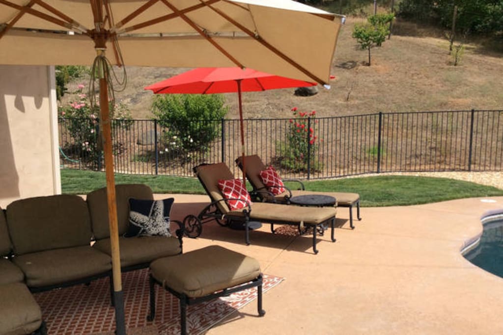 Multiple shaded seating areas around the pool
