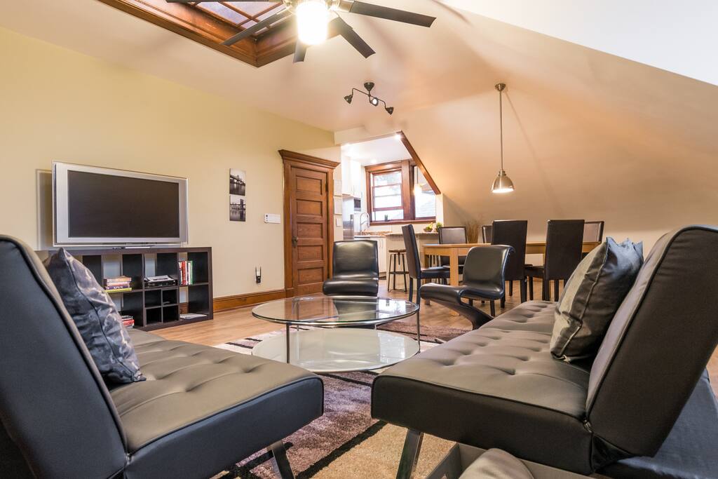 A NYC loft vibe with a tasteful industrial theme, open floor plan, and plenty more private spaces...