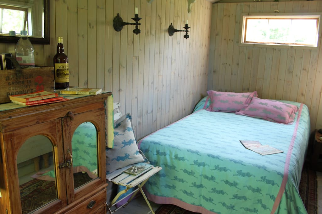 Cosy bed with hare print bed cover