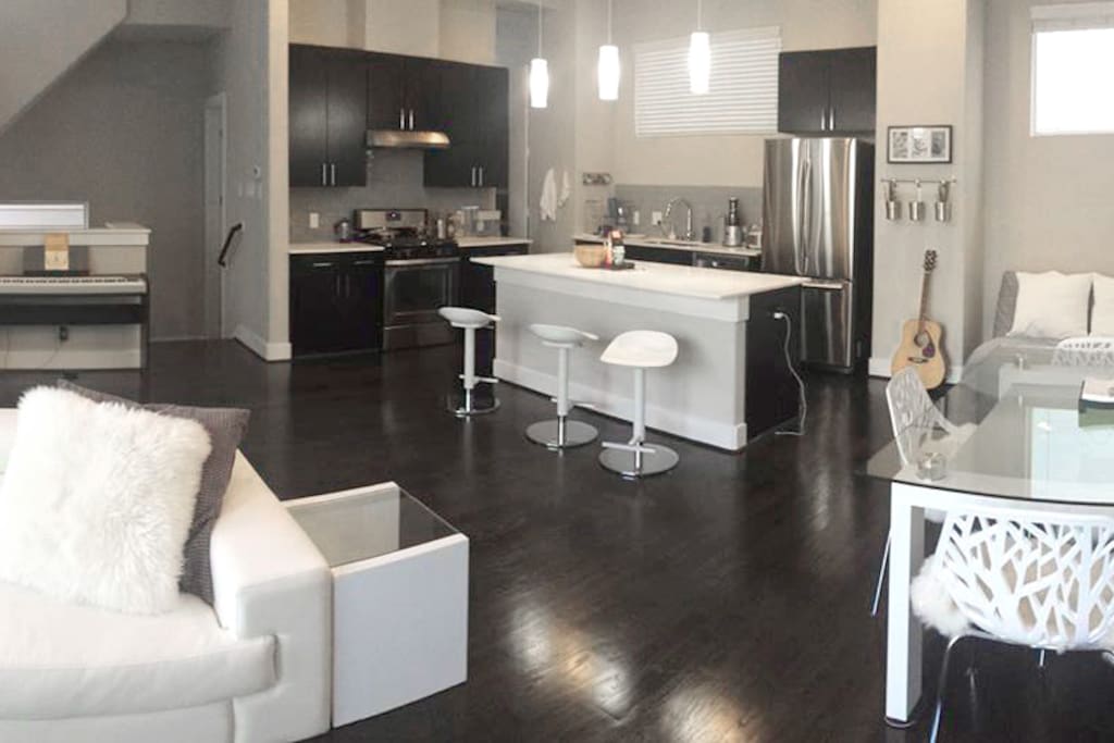 Living/dining/kitchen offers plenty of space to work and relax in. The area features 9-foot ceilings and lots of light.