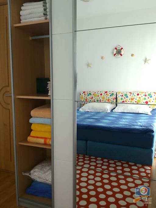 Closet with towels and bed linens