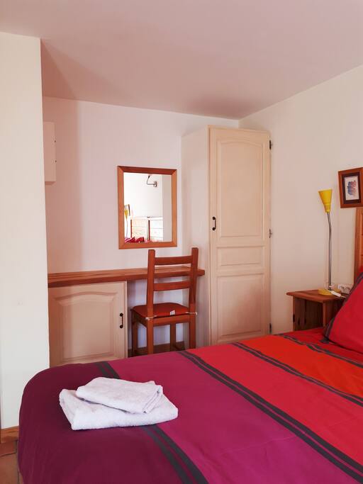 Bedroom with desk and closet