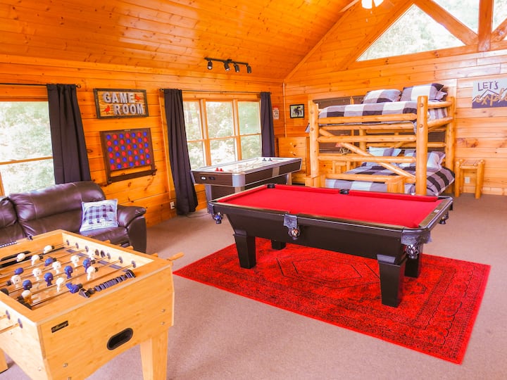 Upstairs game room with queen over queen bunks.