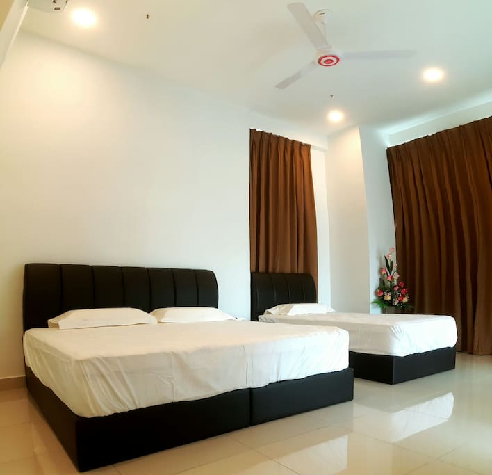 Our Master Living Room are 1 King Bed and 1 Single Bed with Air-conditioning, Fan, WiFi and TV.