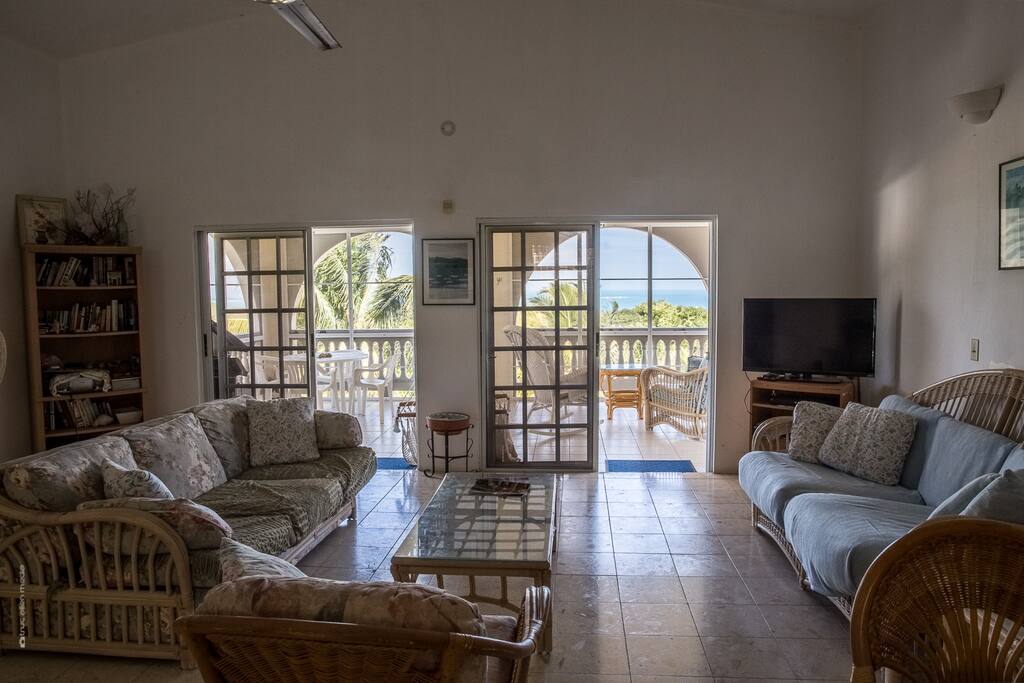 Airy open floor living area and a breathtaking back porch with views to the main island of Puerto Rico.