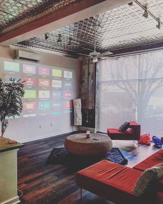 Living room space with Apple TV and projector!