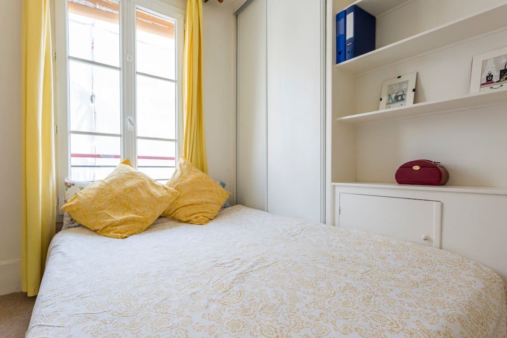 The bedroom has a bed for 2 ppl and is separated from the living room with a door