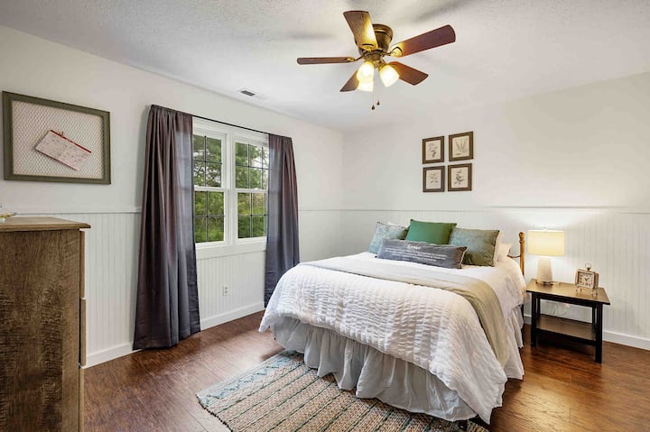 Upstairs bedroom 3 with queen bed, dresser, and walk in closet
