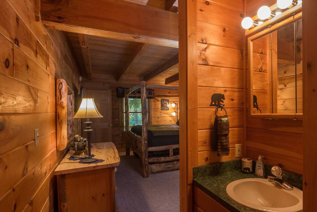 Spacious Master Suite With A Comfy Aspen King Canopy Bed, And A Large Log Dresser With A Beautiful Log Mirror.