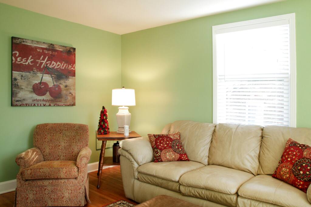 Large comfy leather couch with ottoman. Two large window with lots of light.