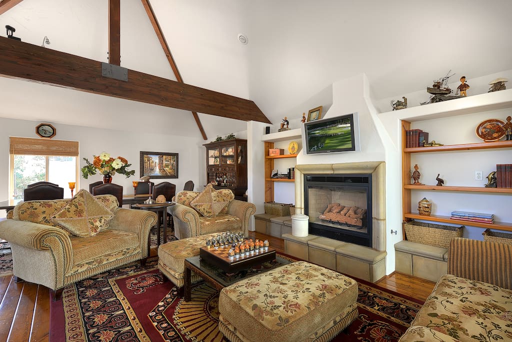 Open concept great room with a gourmet kitchen, living room and two dining areas.