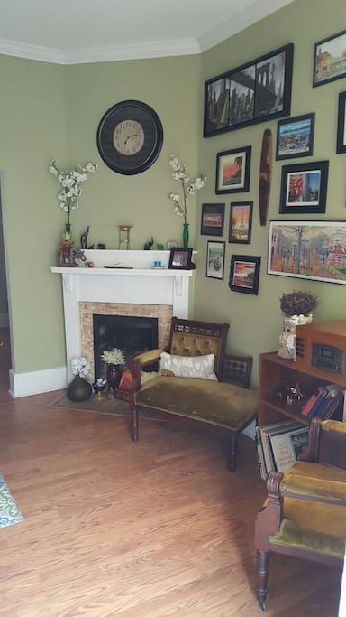 Parlor room with record player and faux fireplace
