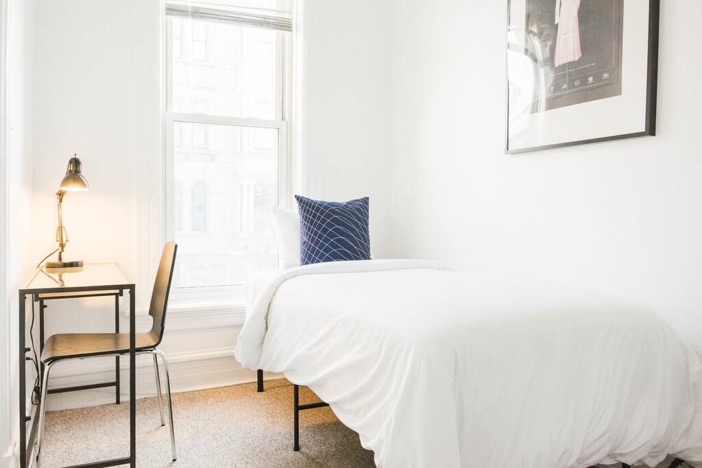 The twin size bed accommodates one guest and includes a desk for the working traveler.
