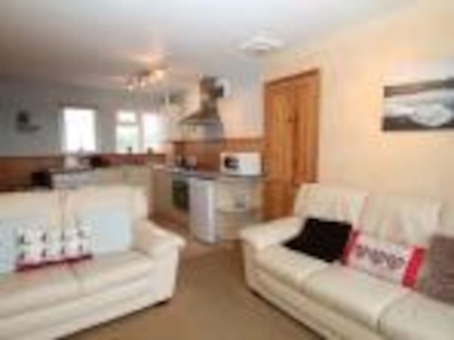 Lounge area has 2 sofas, LCD tv, dvd and freeview -- patio doors lead to balcony with sea views