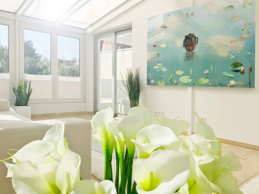 Sunny conservatory with door to the balcony