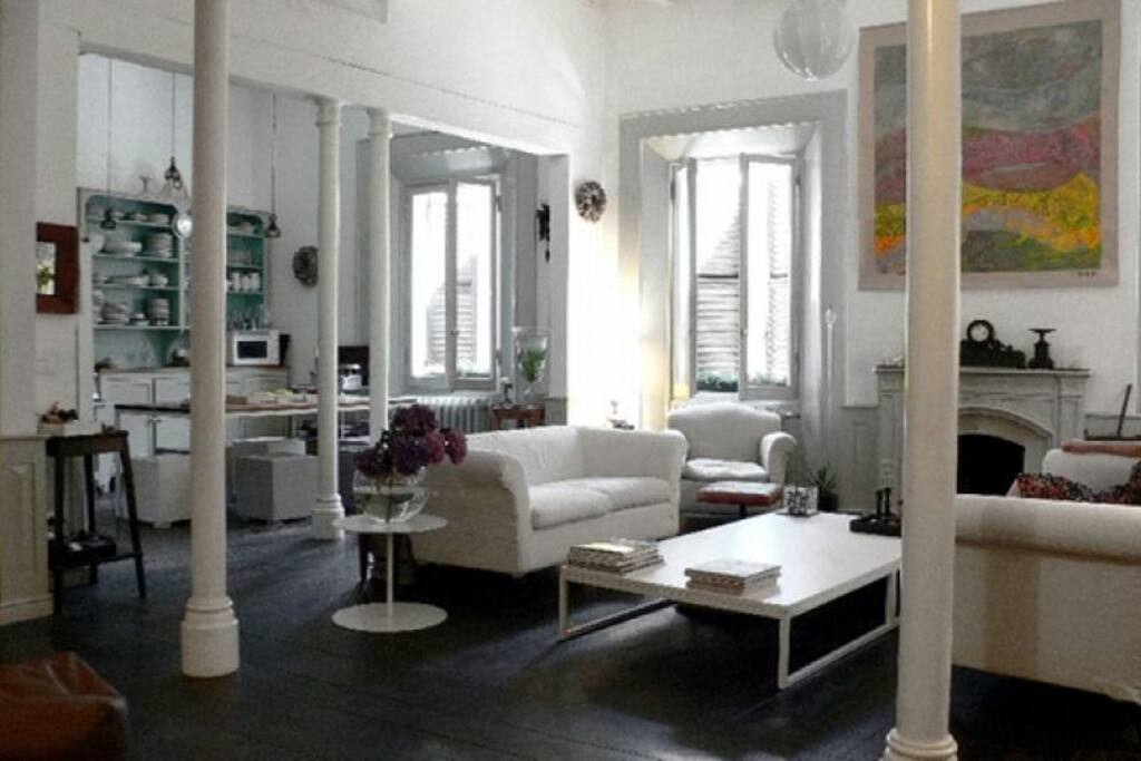 The kitchen, the living room and the fireplace, all in one in the central bright open space.