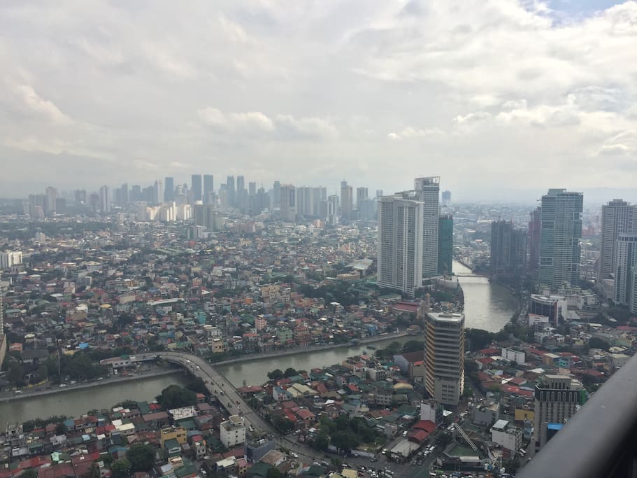 Views of Mandaluyong and Quezon cities skylines.