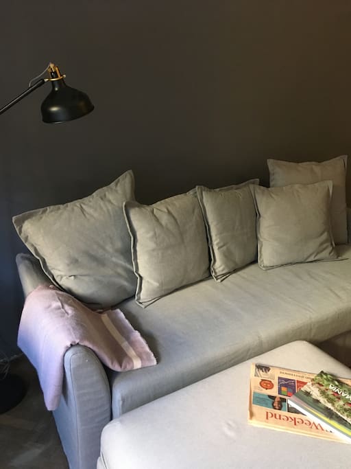 Large sofa in open space lounge/kitchen