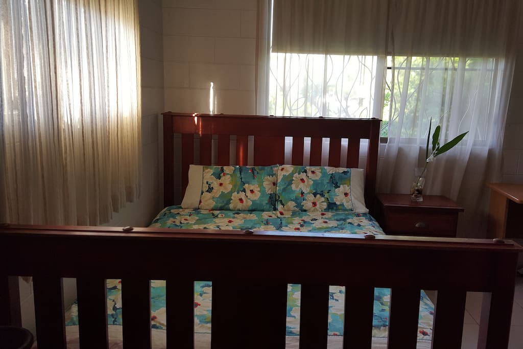 Crisp cotton sheets and cotton cover for tropical living! Internal pull down privacy roller blinds with outside security screens.