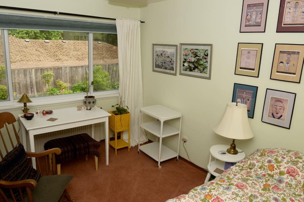 The Healing Oasis Room is freshly painted room with very comfortable single bed, table/desk overlooking garden, rocking chair & cart for storage.