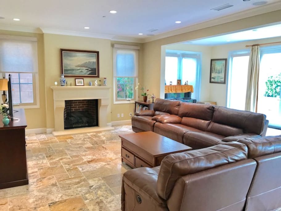 Spacious living room/great room with piano conservatory room