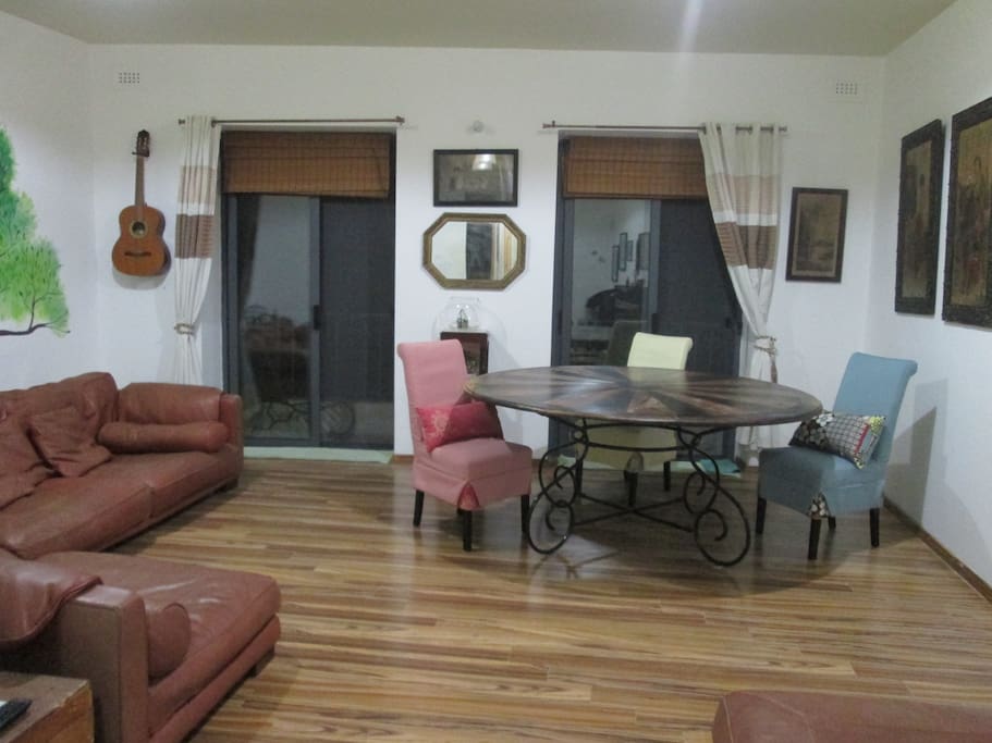 Living / Dining area leading to front balcony with side sea views