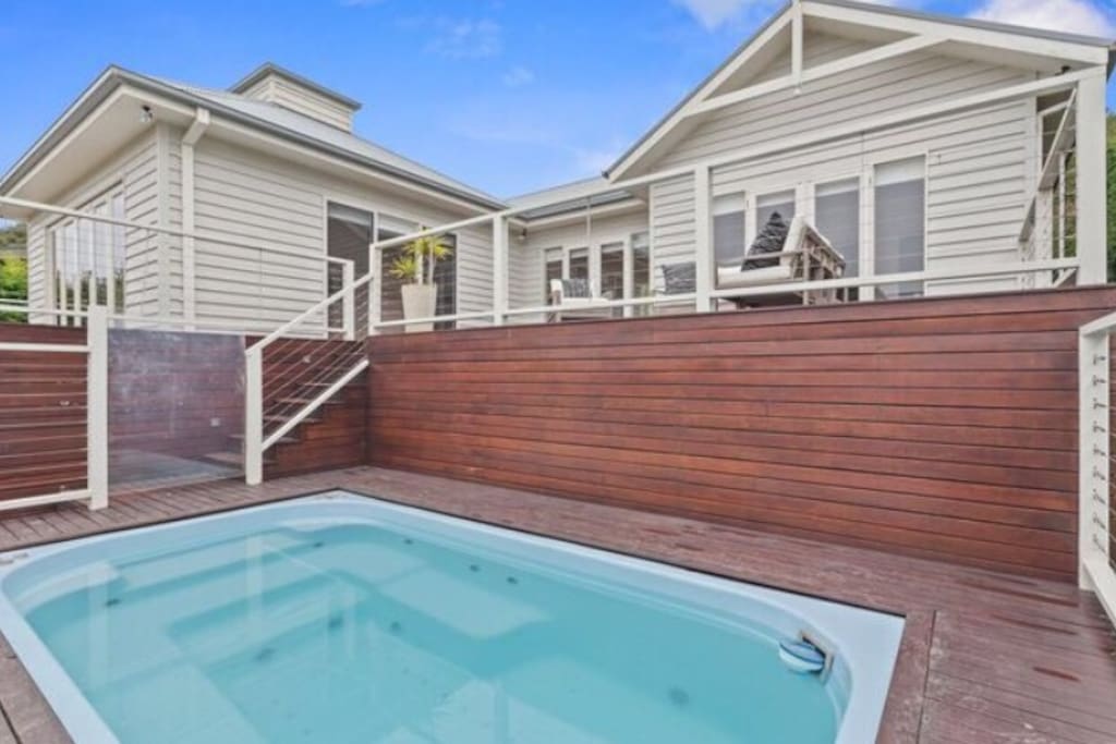 Front of the house with decking and large spa