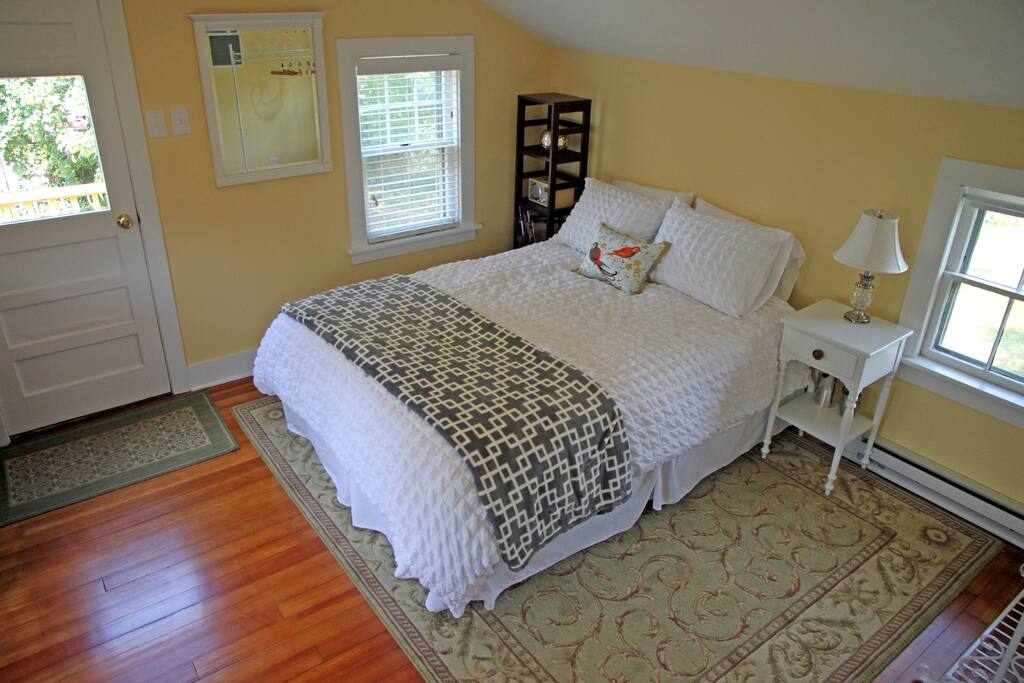 Queen-size bed. Entrance to left