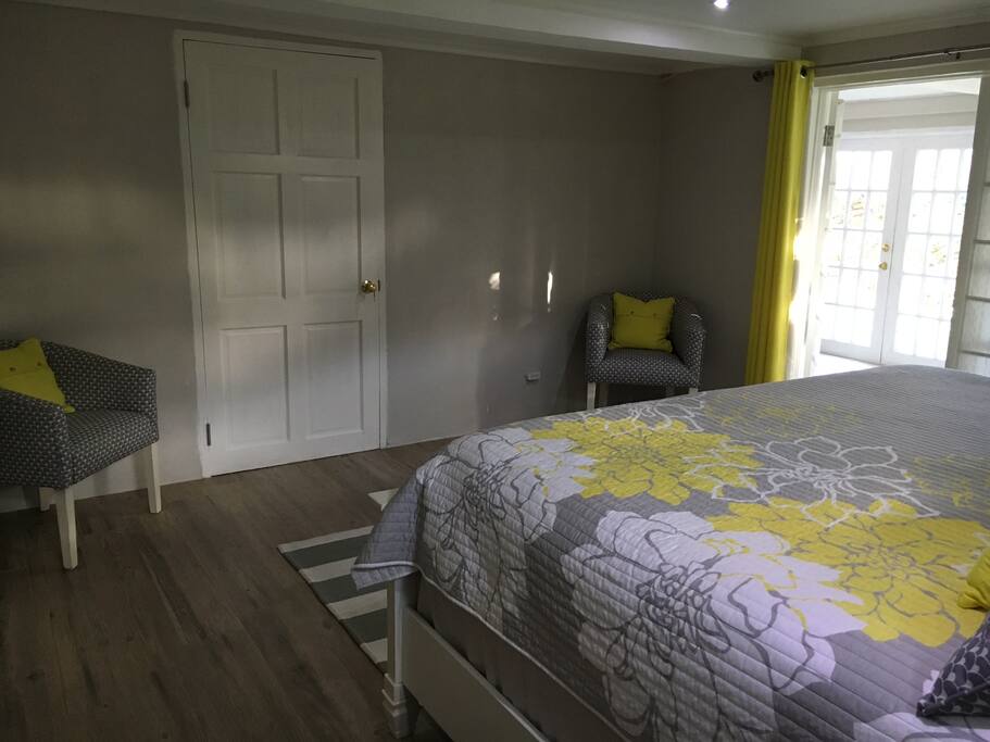 Other view of bedroom - doors open to enclosed porch