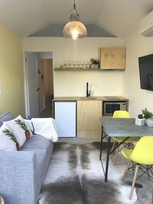 View of living space & kitchenette