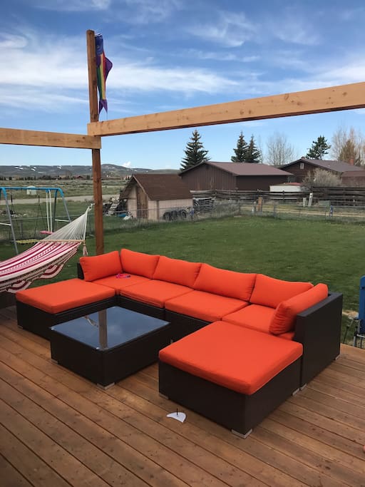 Hot tub, grill, hammock and sectional couch. Can be arranged for outdoor sleeping.
