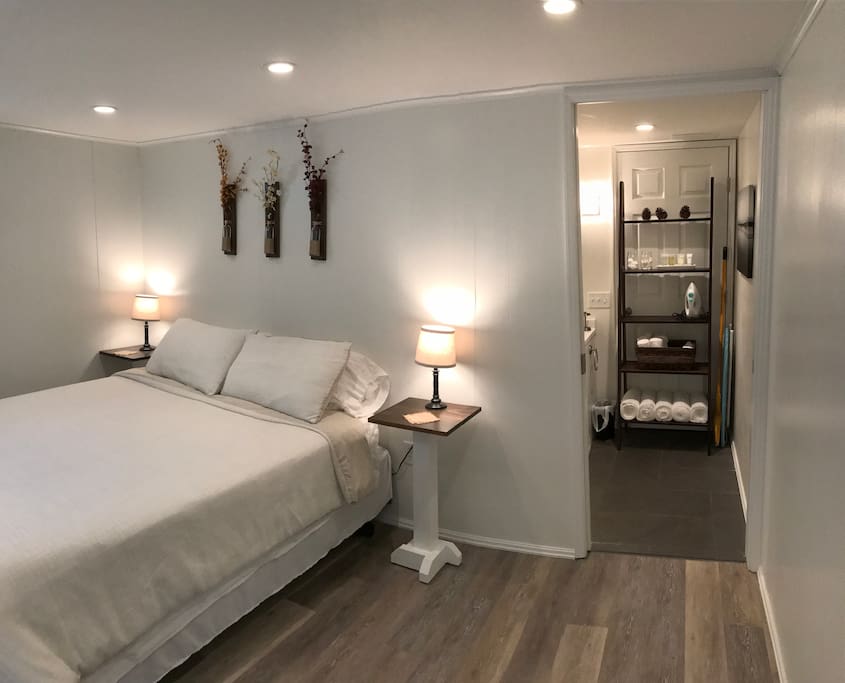 A pocket door separates the bedroom from the bathroom.