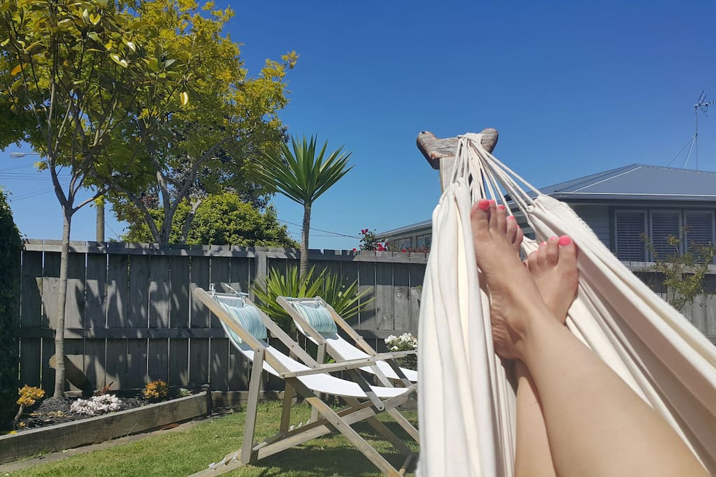 Lovely and sunny outdoors. Sunny deck, deck chairs and hammock to relax.