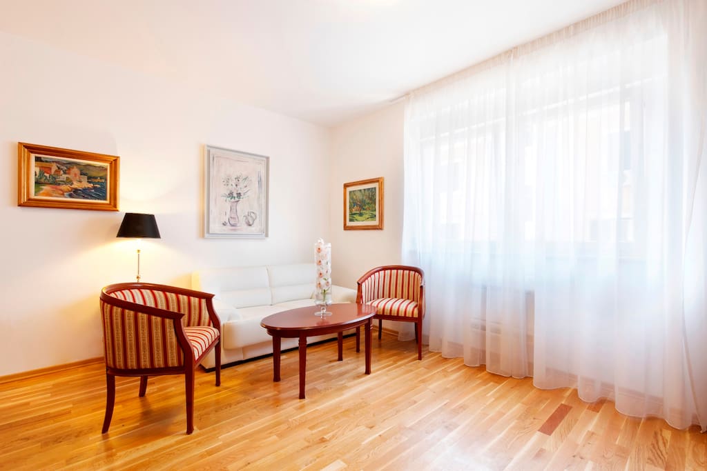 Very spacious living and dining area, with a flat-screen TV.
The area has plenty of natural light during the day.