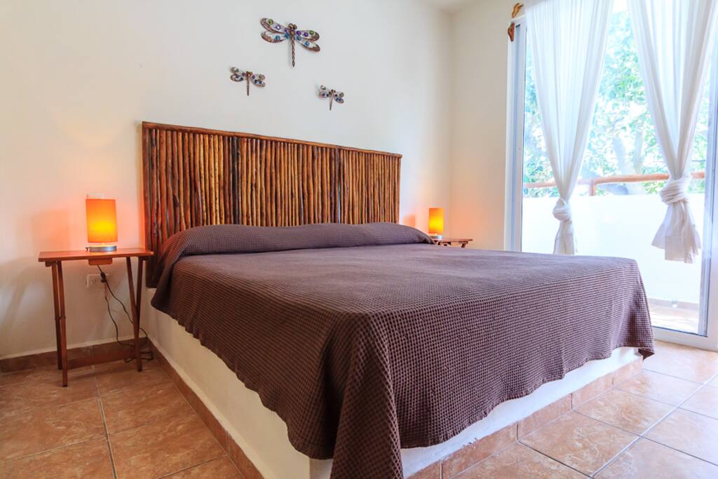 Second bedroom with sliding doors onto terrace at the front of house.