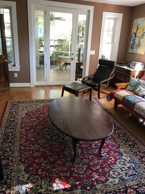 This is the family room, which includes a tv and access to the screened porch.