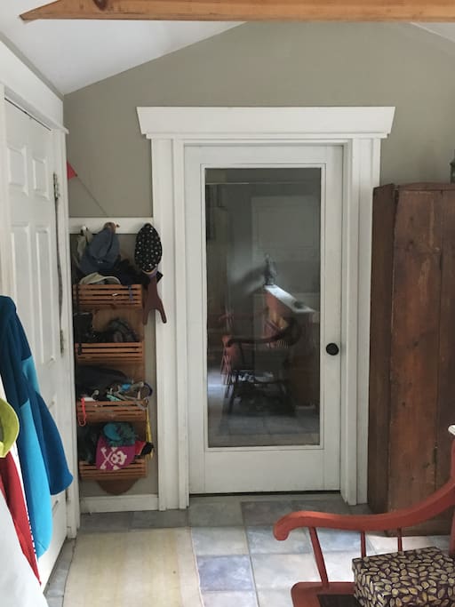 Door separating our home from guest's space.Door shown on the left is entry.
