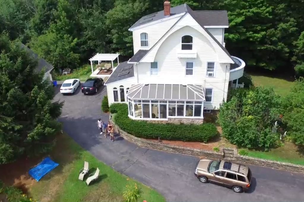Ariel view showing the Conservatory and outdoor Pergola with Firepit