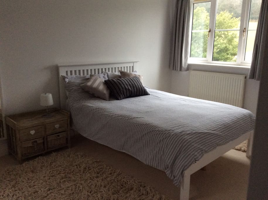 Double bedroom with en-suite, over looking garden, paddock and forest.