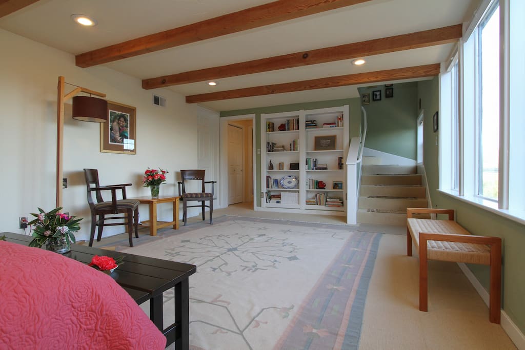 Master bedroom downstairs with view of scenic river and valley below
