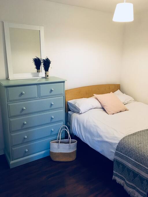 Just off the living area is the cosy studio bedroom
