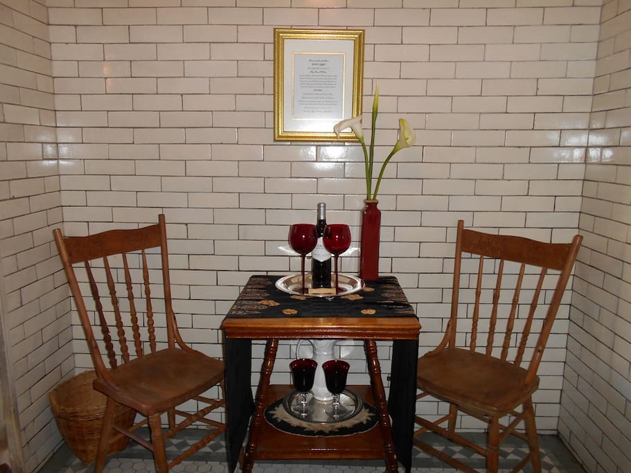 The seating area, complete with a bottle of "Bloodeaux" wine