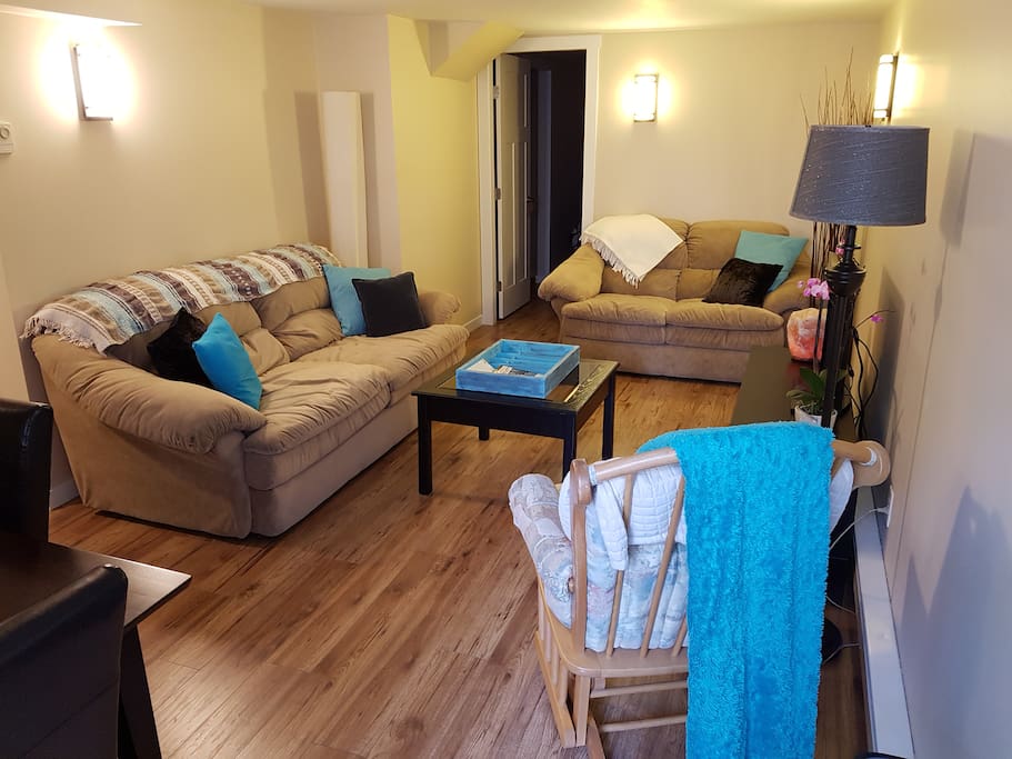 Great living room to relax and unwind after a day of exploring. The door to your room is located in this picture