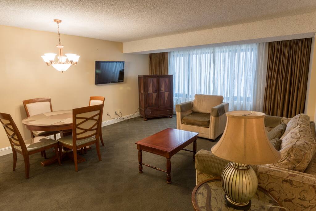 The living room-dining room combo is perfect for a quick meal or casual gathering.