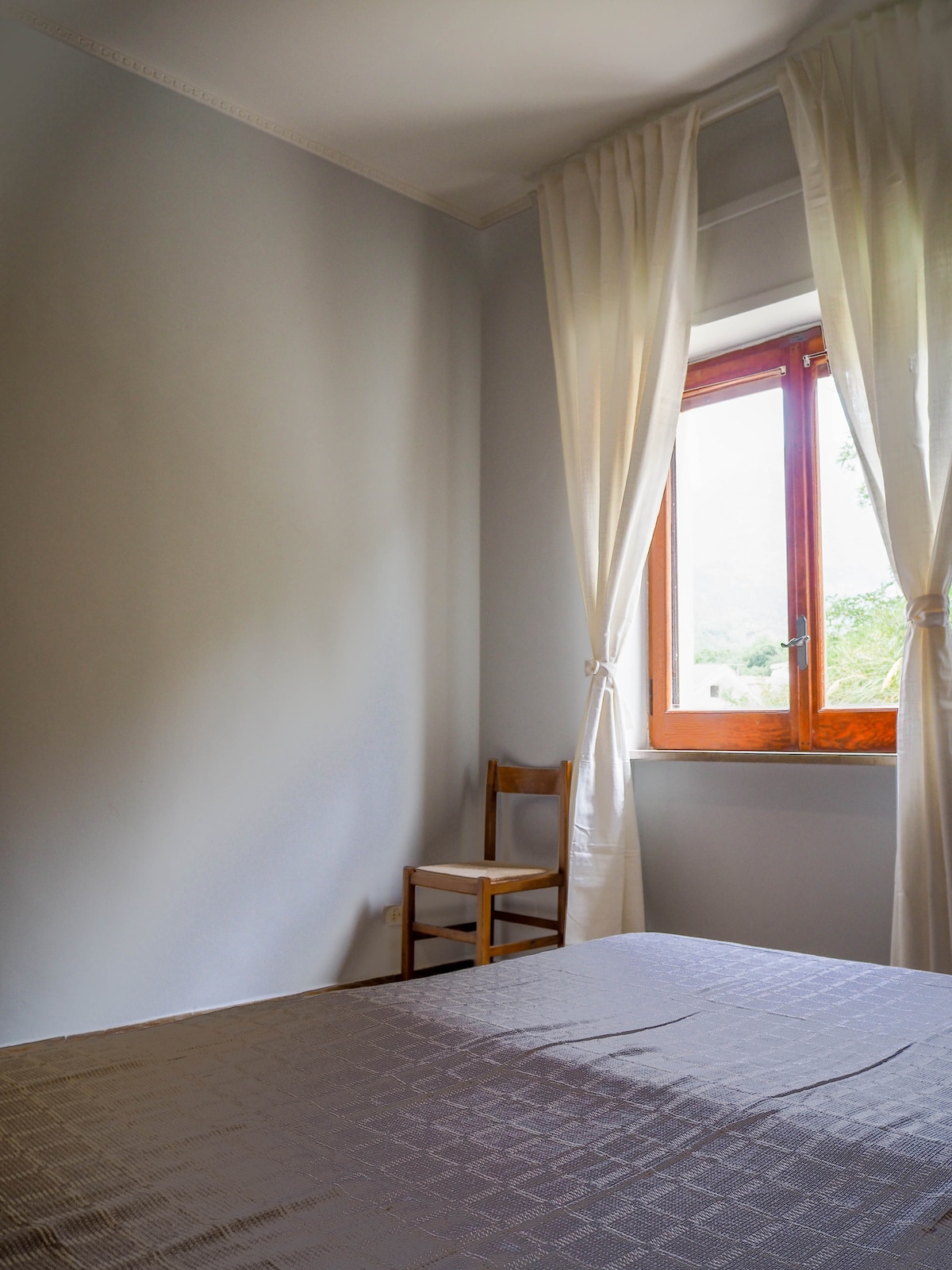 The second bedroom has a private window that opens up to a mountain view from the bed...