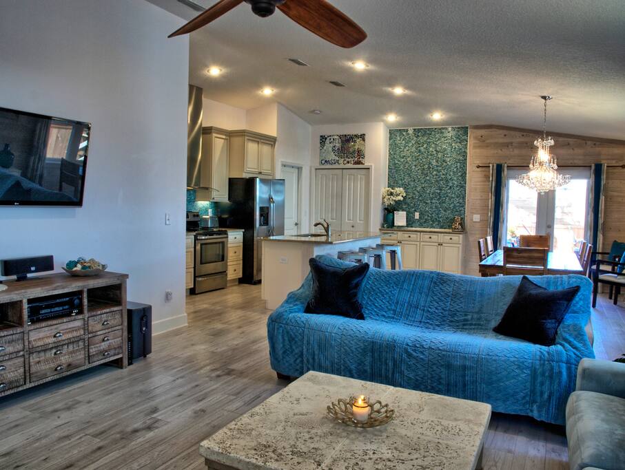 Living room to open plan dining and kitchen areas