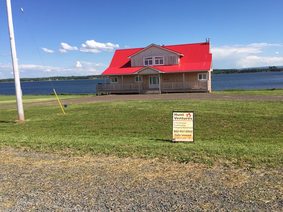 View of the house from Sand Point Road - you won't miss the red roof!