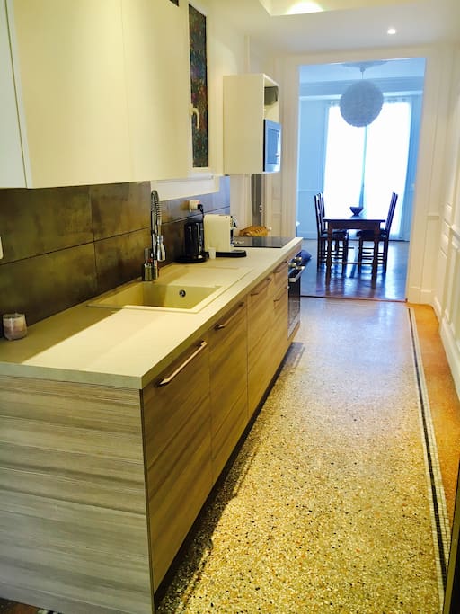 Kitchen with washing machine, dishwasher, microwave oven