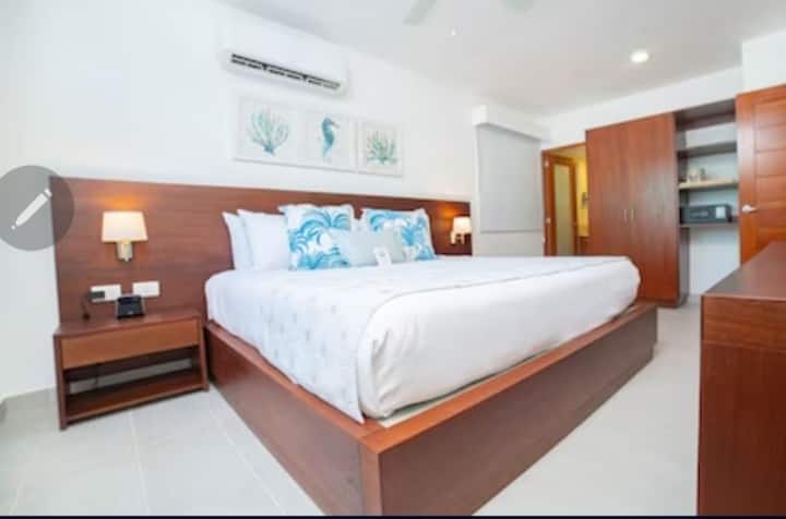 Deluxe King Bed with closet, dresser, Flat screen TV